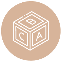 A brown circle with a white outline of a toy block showing the letters A, B, and C on its visible sides.